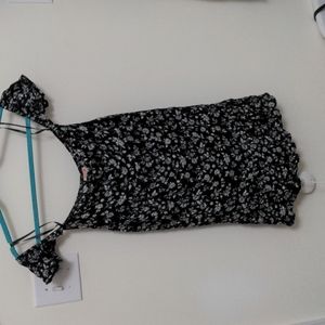 Black strapless dress with white flower detail